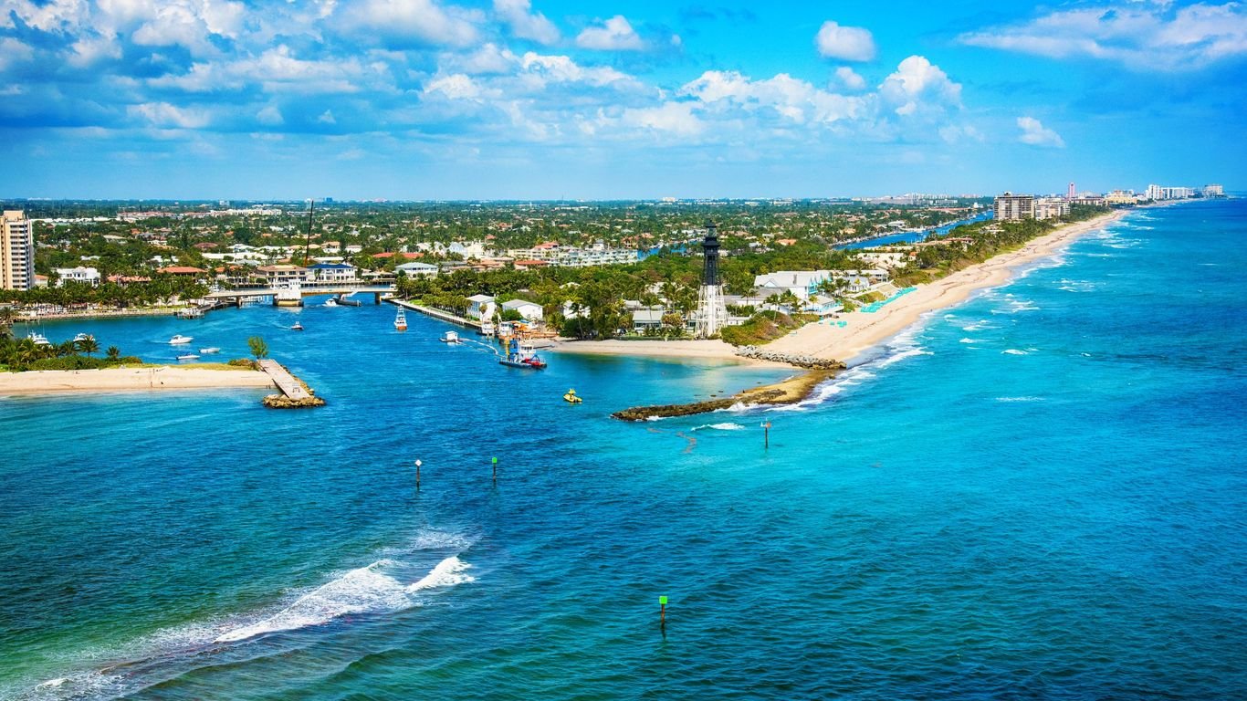 Pompano Beach car service with scenic aerial view of coastline and lighthouse