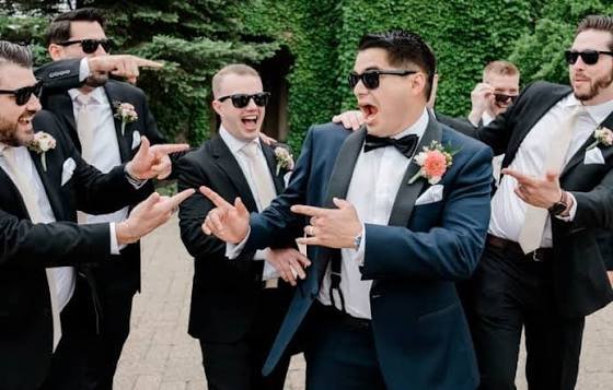 Prom and graduation transportation with cheerful group celebrating in formal wear