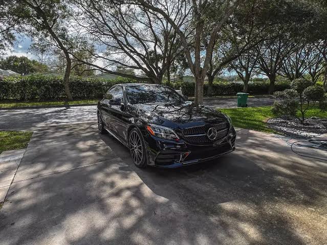 Limo Service Coral Springs with black luxury sedan parked on a driveway