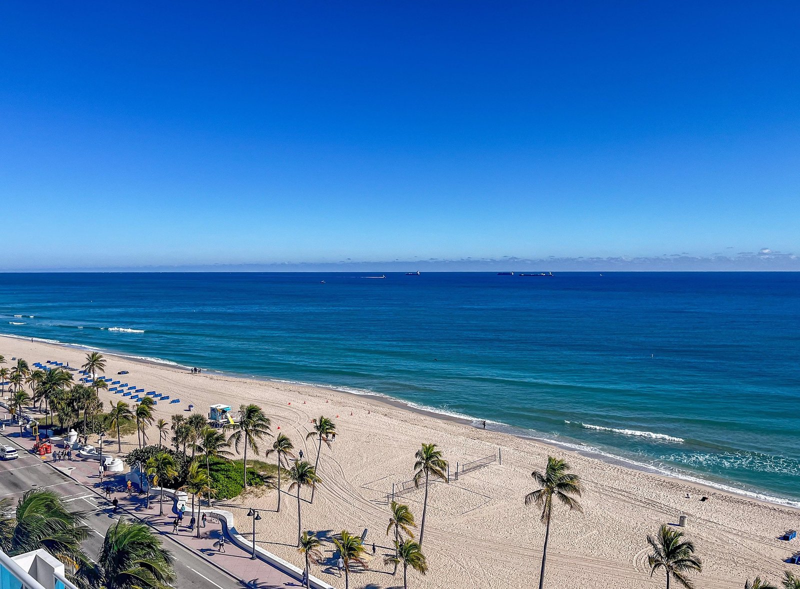 Limo Service Miami Beach with scenic ocean and sandy beach view from above